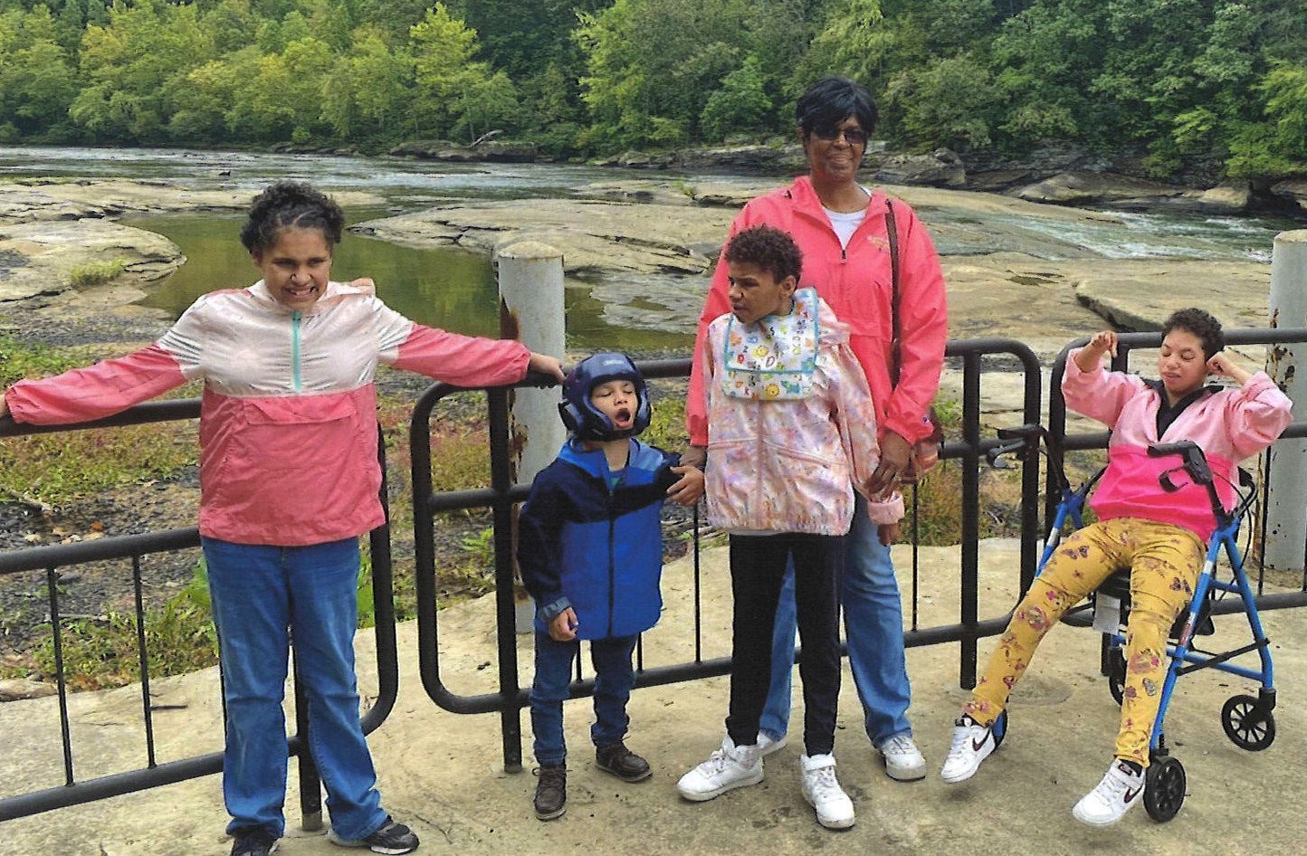 Woman and her three children and one granddaughter standing outside at Lake Cumberland.
